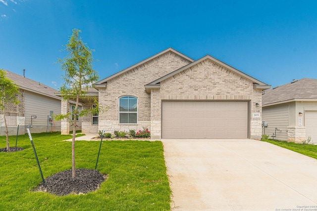 view of front of house with a garage and a front yard