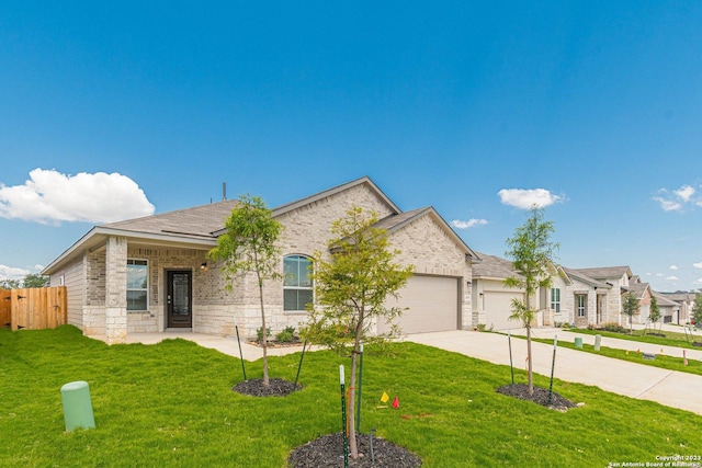 view of front of property featuring a garage and a front yard