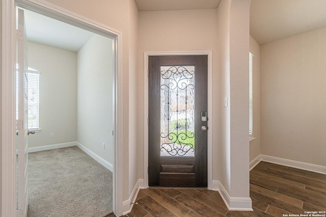 entrance foyer with dark hardwood / wood-style floors