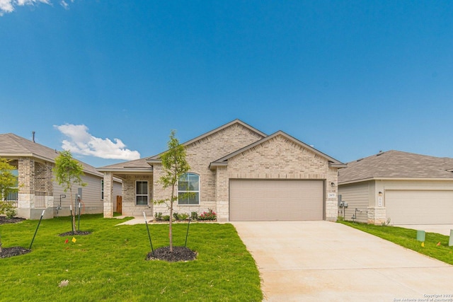 single story home with a garage and a front lawn