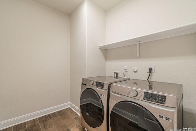 laundry area with washing machine and dryer