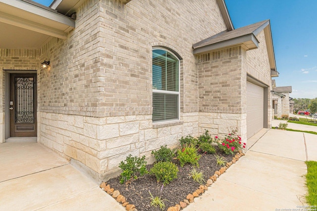 doorway to property featuring a garage