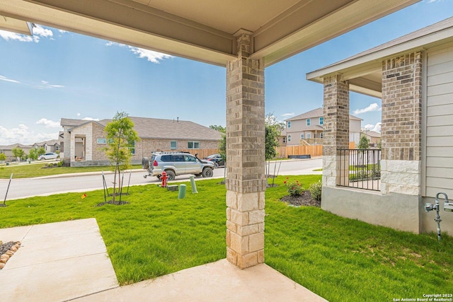 view of yard with covered porch