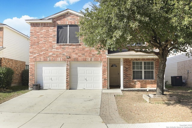 view of front property with cooling unit and a garage