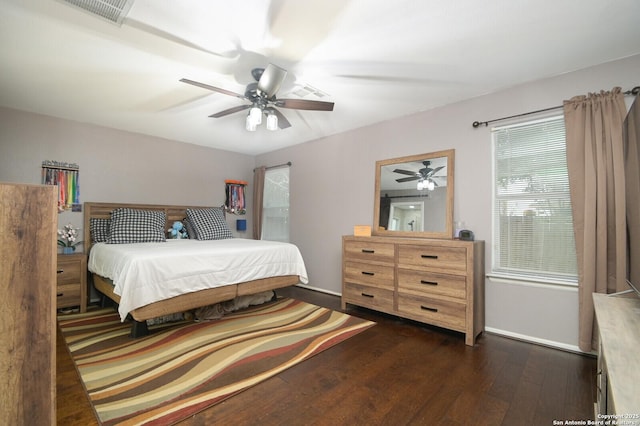 bedroom featuring ceiling fan and dark hardwood / wood-style flooring