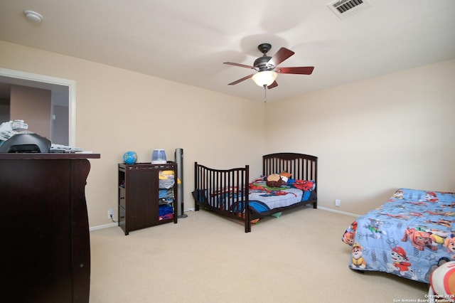 carpeted bedroom featuring ceiling fan