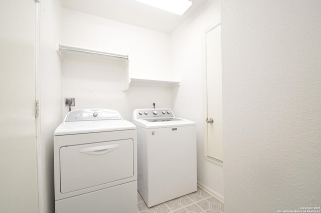 clothes washing area with independent washer and dryer