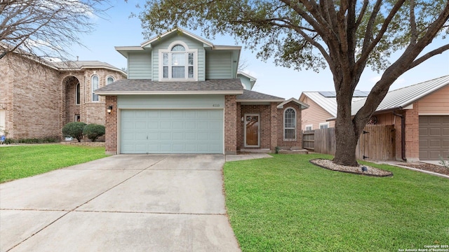 view of front of house featuring a garage and a front yard