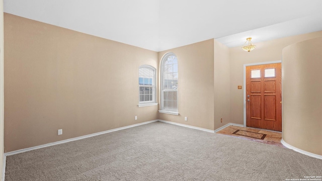 view of carpeted entrance foyer