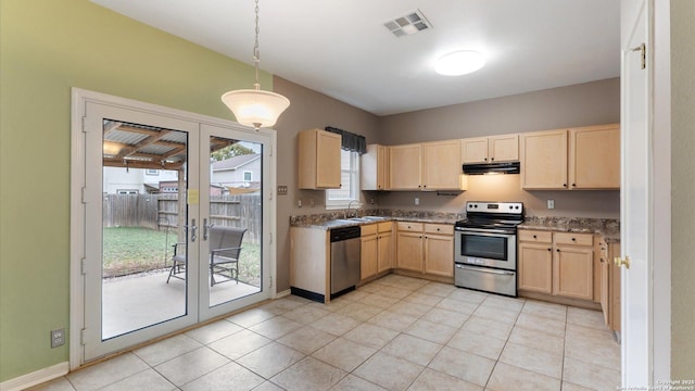 kitchen with stainless steel appliances, sink, pendant lighting, and light brown cabinetry