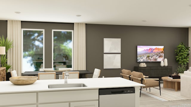 kitchen with dishwasher, sink, white cabinets, and light wood-type flooring