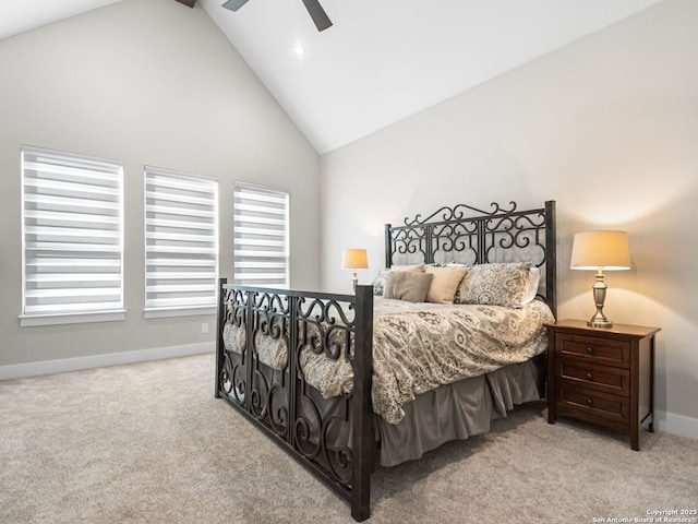 bedroom featuring ceiling fan, light colored carpet, and high vaulted ceiling