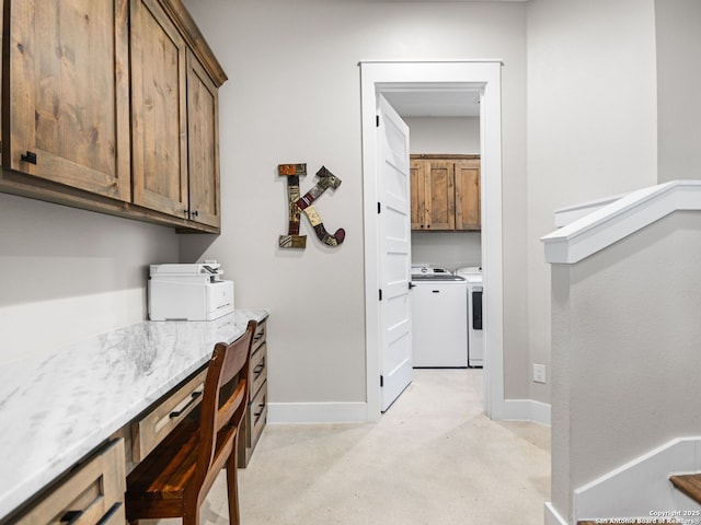 laundry room featuring cabinets and washer and dryer