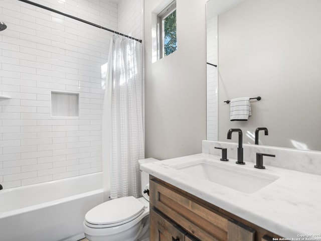 full bathroom with vanity, toilet, and shower / bath combo with shower curtain