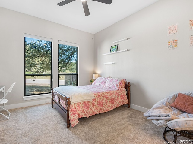 bedroom with light carpet and ceiling fan