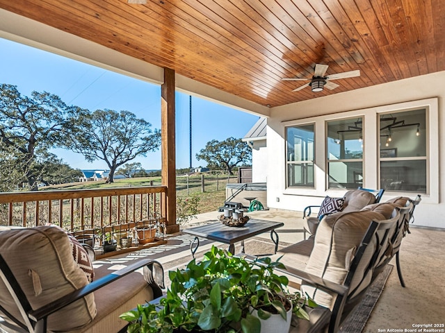 view of patio with ceiling fan and outdoor lounge area