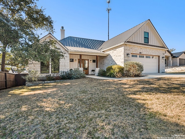 view of front of house featuring a garage and a front lawn