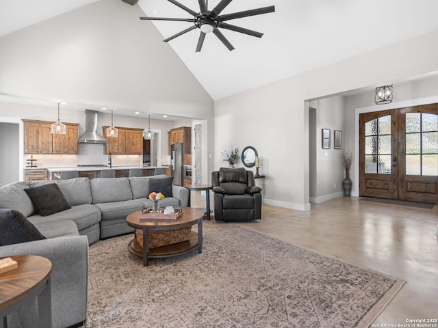 living room featuring high vaulted ceiling, french doors, and ceiling fan