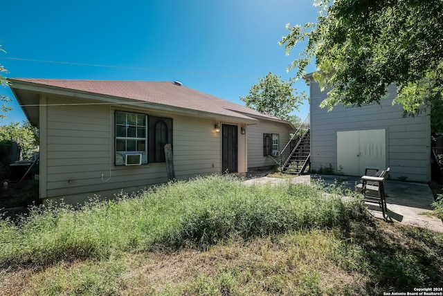 back of house with cooling unit and a patio area