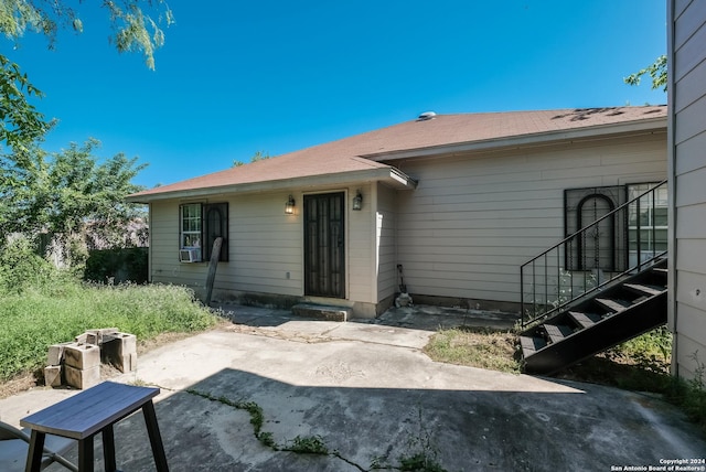 back of house featuring cooling unit and a patio