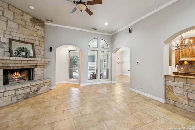 living room featuring a large fireplace, a high ceiling, ornamental molding, light tile patterned floors, and ceiling fan