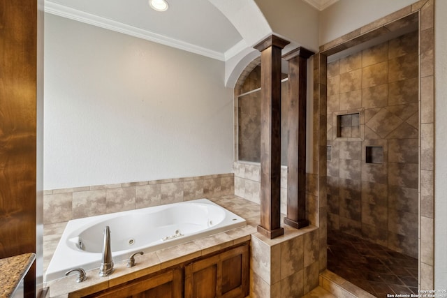 bathroom featuring ornate columns, crown molding, and shower with separate bathtub