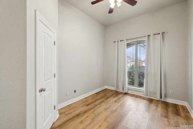 spare room featuring ceiling fan and light wood-type flooring