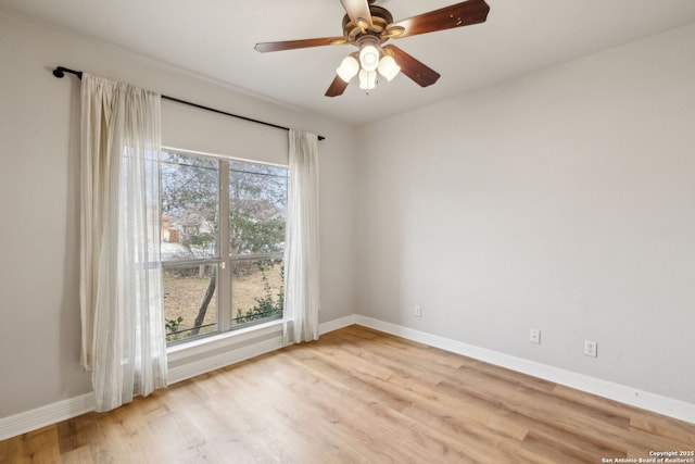 unfurnished room with ceiling fan and light wood-type flooring