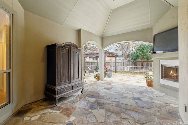 view of patio with an outdoor fireplace