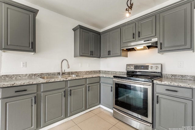 kitchen with sink, electric range, gray cabinets, and light tile patterned flooring