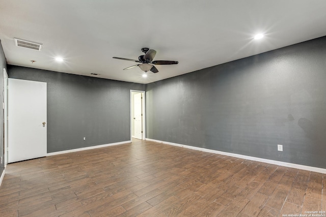 unfurnished room with hardwood / wood-style floors and ceiling fan