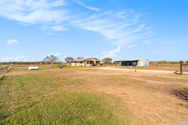 view of yard with a rural view