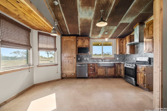 kitchen with sink, extractor fan, decorative light fixtures, appliances with stainless steel finishes, and backsplash