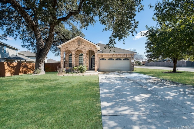 single story home featuring a garage and a front yard