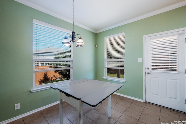 dining area featuring ornamental molding, a healthy amount of sunlight, and tile patterned floors