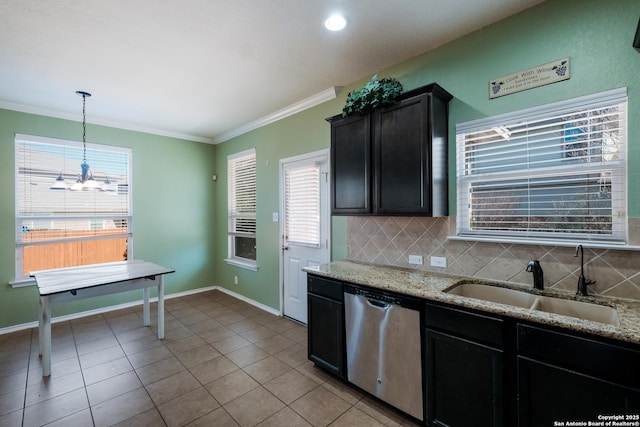 kitchen featuring pendant lighting, sink, light stone counters, tasteful backsplash, and stainless steel dishwasher