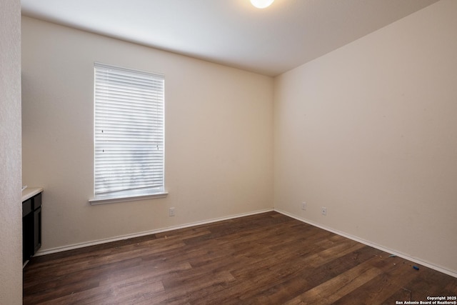 unfurnished room featuring dark hardwood / wood-style floors