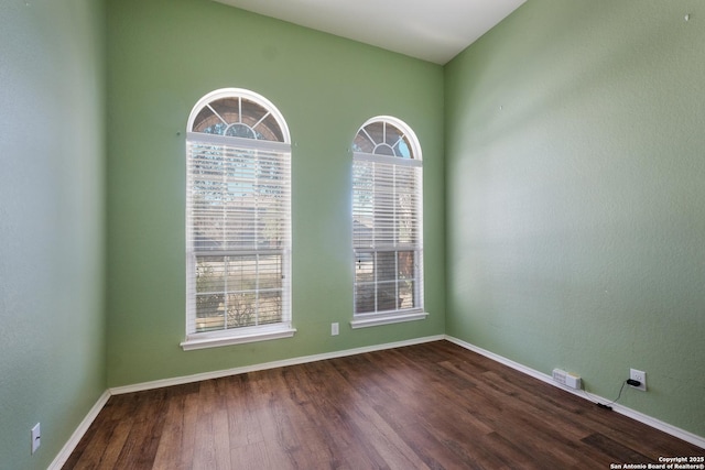 spare room featuring hardwood / wood-style flooring