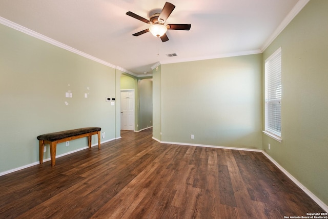 unfurnished room featuring ornamental molding, dark hardwood / wood-style floors, and ceiling fan