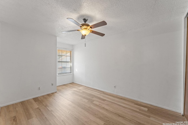 unfurnished room with a textured ceiling, light hardwood / wood-style flooring, and ceiling fan