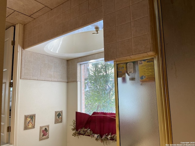 bathroom featuring tiled bath