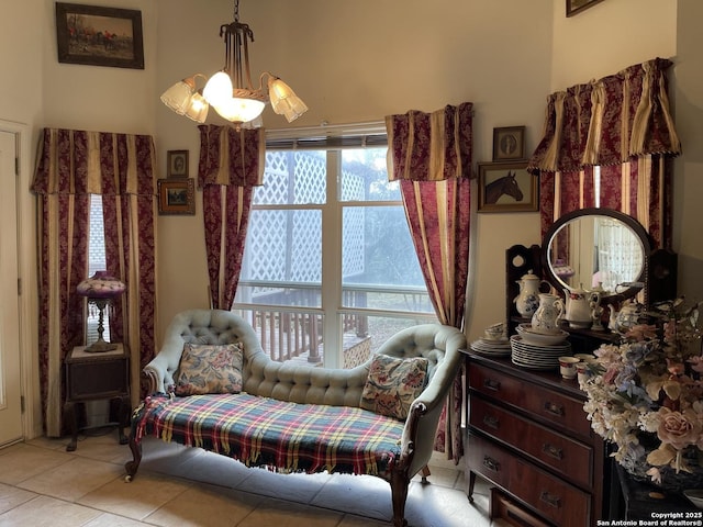 sitting room with light tile patterned flooring and a notable chandelier