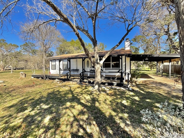 view of front of house with a front lawn and covered porch