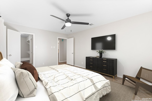 bedroom with a spacious closet and ceiling fan