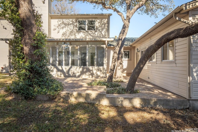 back of property featuring a sunroom