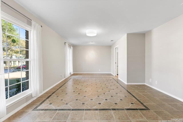 unfurnished room with tile patterned floors