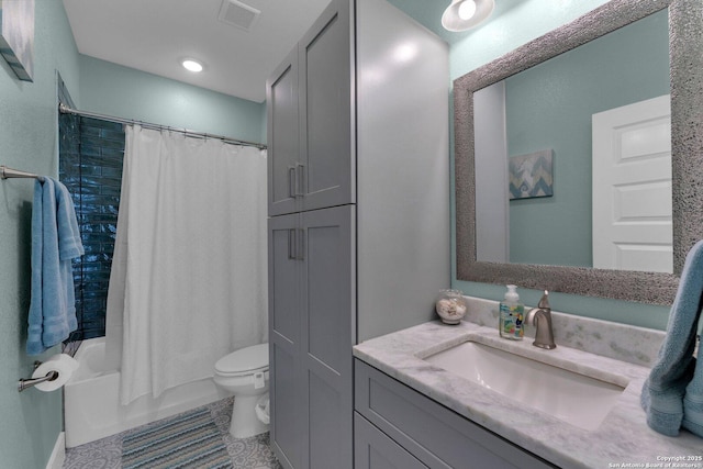 full bathroom with vanity, toilet, and shower / bath combo with shower curtain