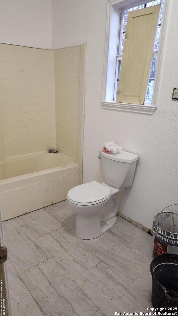 1601 Fulton Ave, San Antonio, TX 78201 - full bathroom with toilet, a bath, and a shower