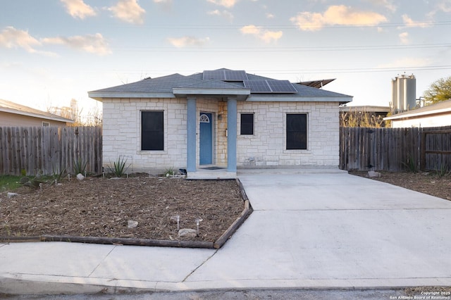 view of front of home featuring solar panels