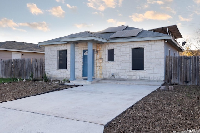 view of front of home featuring solar panels